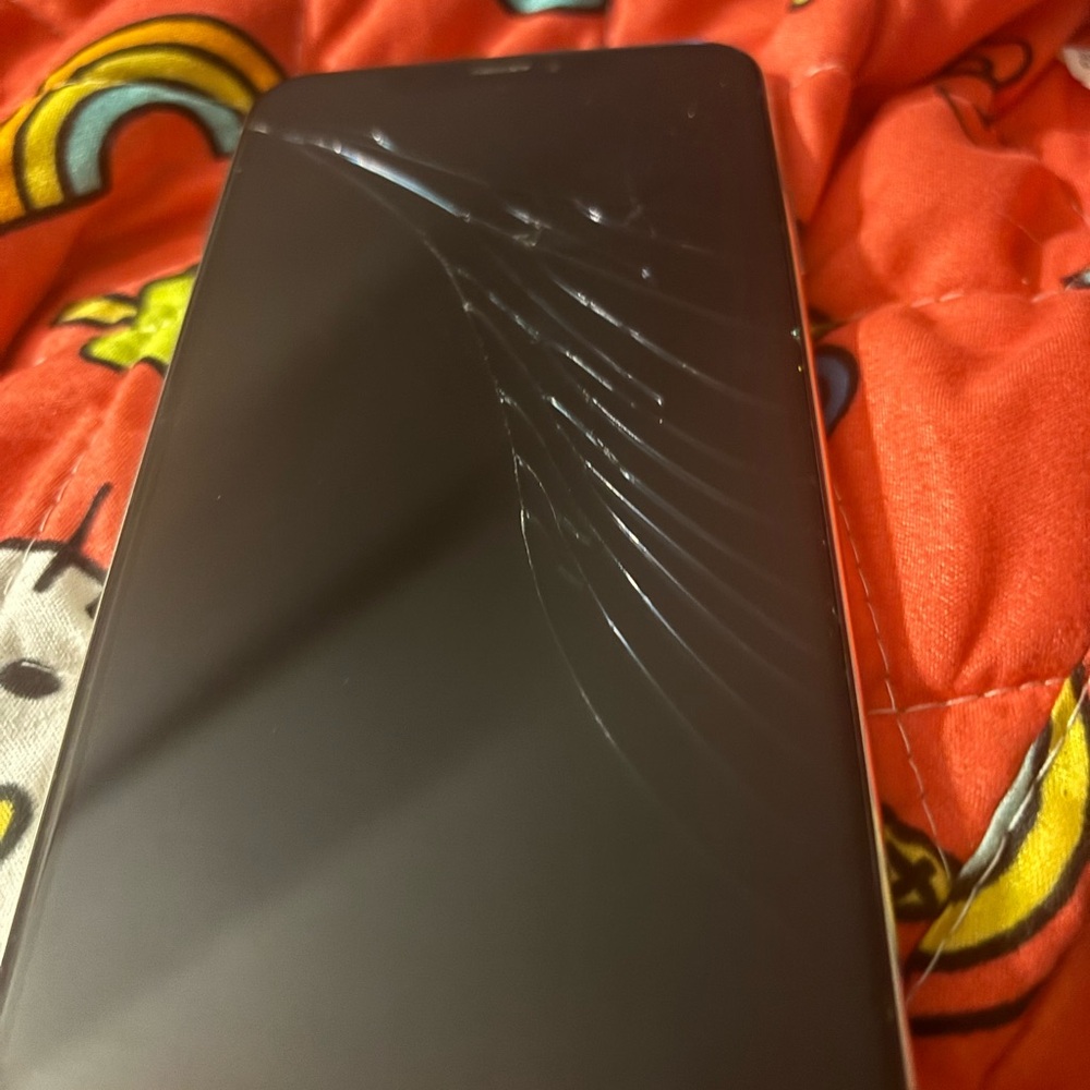 I phone Xs Max. Black Smartphone with Cracked Screen